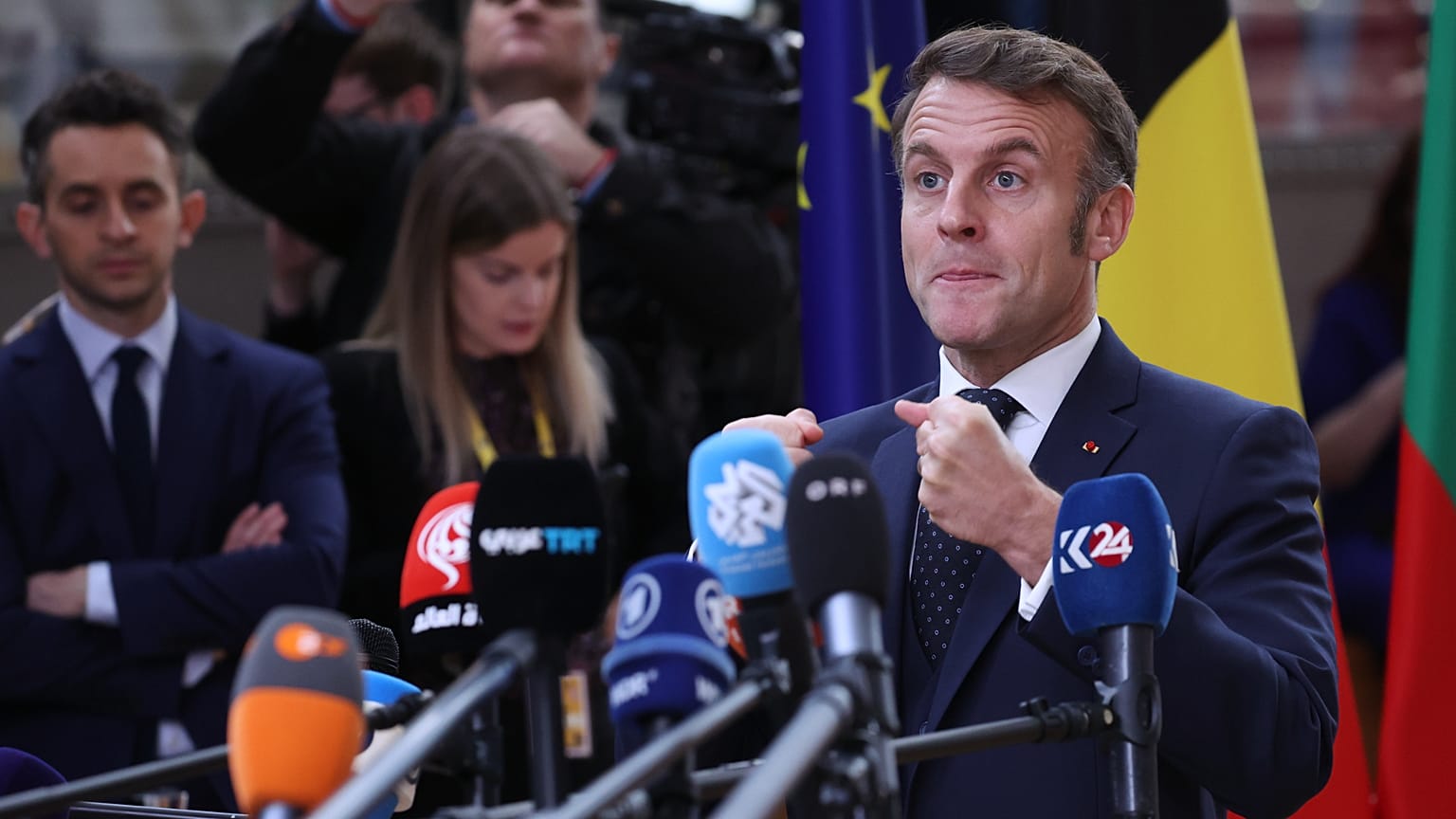 French President Emmanuel Macron speaks with the media in Brussels