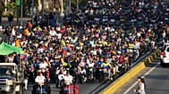 Government supporters ride motorbikes through Caracas, Venezuela