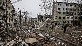 A soldier walks through the ruins of the town of Kostyantynivka, in the Donetsk region, Ukraine. Saturday Dec. 20, 2025