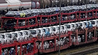 Brand new cars of German car manufacturer Volkswagen and BMW are parked on a freight train in Munich, 14 October, 2021