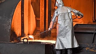 A handles molten metal at the Thyssenkrupp steel factory in Duisburg, Germany, April 27, 2018.