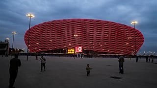 People take photos outside Prince Moulay Abdellah Stadium, which will host the opening and final game of the Africa Cup of Nations soccer competition, in Rabat, Dec. 19, 2025