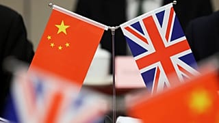 Flags of China and the Union Jack stand during the China-UK Energy Dialogue in Beijing, 17 March, 2025
