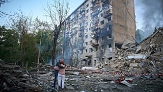 Residents react after a Russian missile hit an apartment building during Russia's combined missile and drone air attack in Kyiv, Ukraine, June 17, 2025