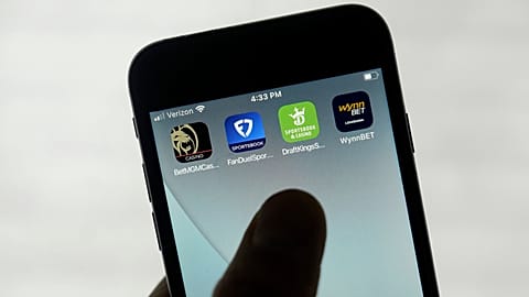 FanDuel, DraftKings, and other online gambling apps are displayed on a phone on Sept. 26, 2022. 