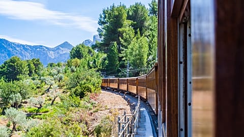 Scenic view of mountains onboard the Tren de Sóller.
