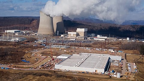 A data center owned by Amazon Web Services, front right, is under construction next to the Susquehanna nuclear power plant in Berwick, Pa., Jan. 14, 2025.